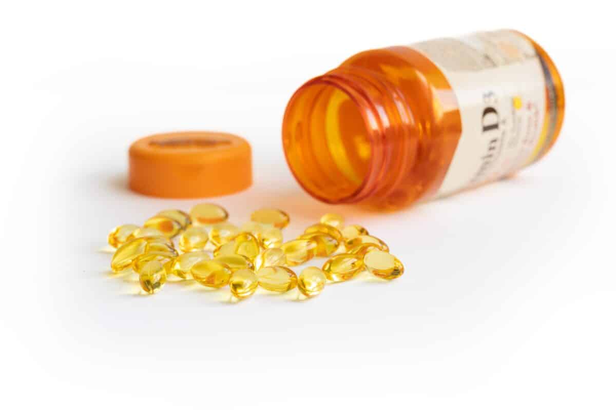 Vitamin D3 supplement capsules spilled