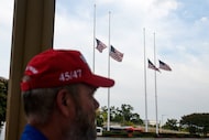 Kevin Vanriper, of Sarasota, Fla., joins other people waiting in line for a memorial and...