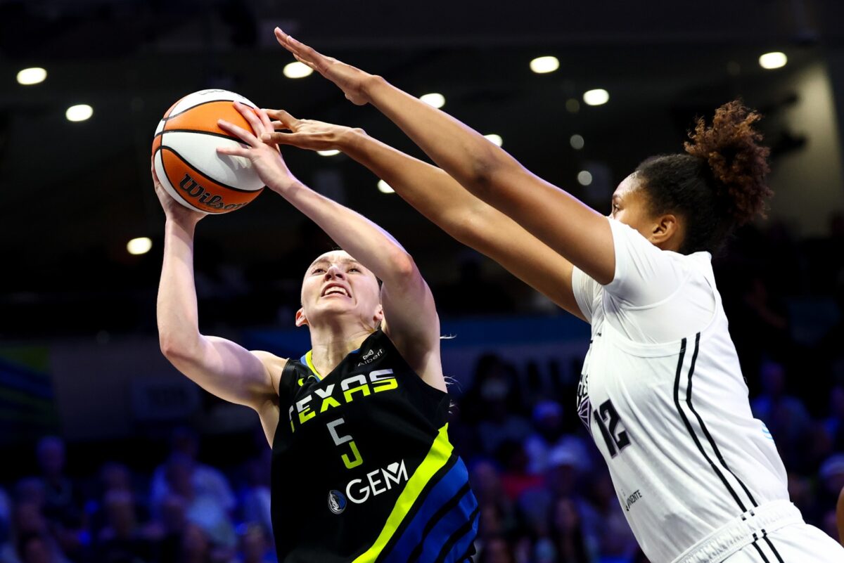 Dallas Wings guard Paige Bueckers (5) shoots as Golden State Valkyries center Iliana Rupert (12) defends during the second half at College Park Center.