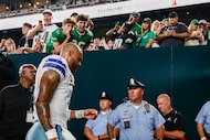 Dallas Cowboys quarterback Dak Prescott heads off the field after warmups before the first...