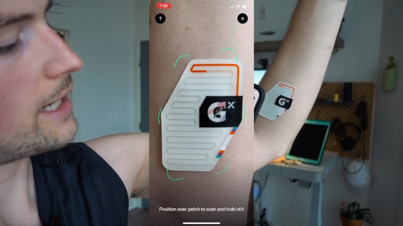A person uses a wearable diagnostic patch on the arm to track health data with a connected app