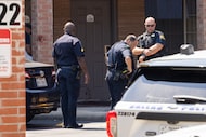 Dallas police work the scene as they respond to a report of a stabbing at the Downtown...