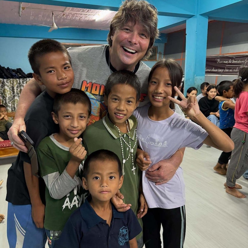Blair Pogue, center, visiting an orphanage he works with in India in 2024.