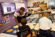 First grade teacher Tevin Wright teaches student in his classroom at Albert C. Black STEAM...