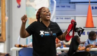 Charisma Presley of Philly Aquatics speaks to students about safety during dry-land skills training at the Finley Rec Center in North Philadelphia on July 30, 2025.