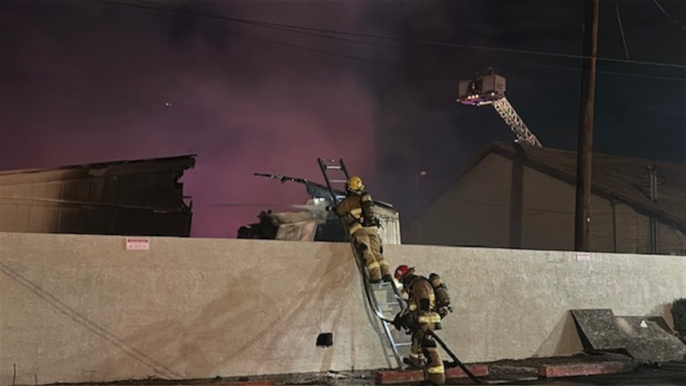Phoenix firefighters work on the scene of a structure fire in the area of 7th Street and...