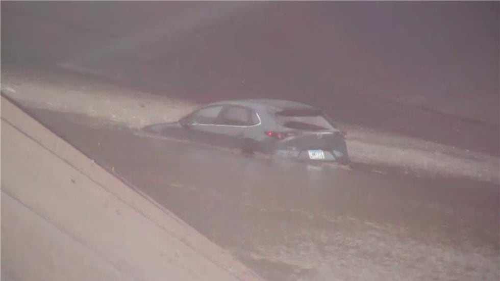 A car was seen stuck on the underpass at the I-10/I-17 split in Phoenix on Sept. 26, 2025.