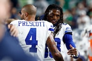 Dallas Cowboys wide receiver CeeDee Lamb (88) hugs quarterback Dak Prescott (4) during the...