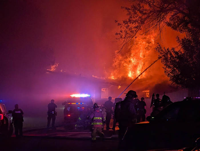 Authorities responding to barricaded suspect, fire at North Side home