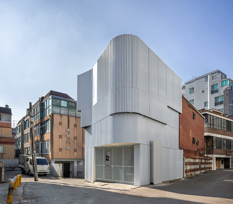 drawing works clads one-person house in seoul with layered corrugated steel facade