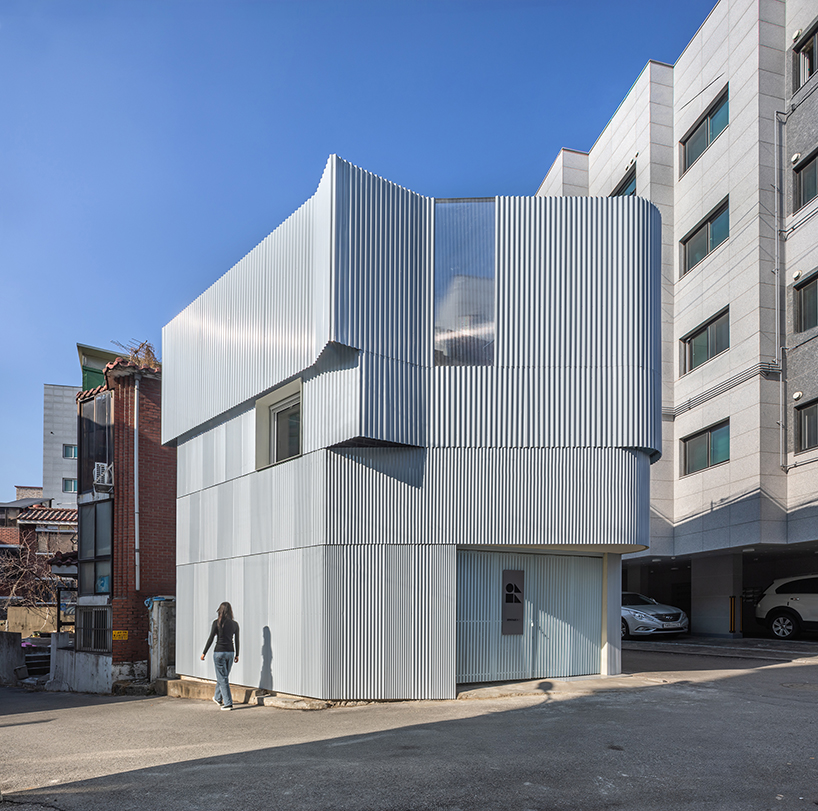 drawing works clads one-person house in seoul with layered corrugated steel facade