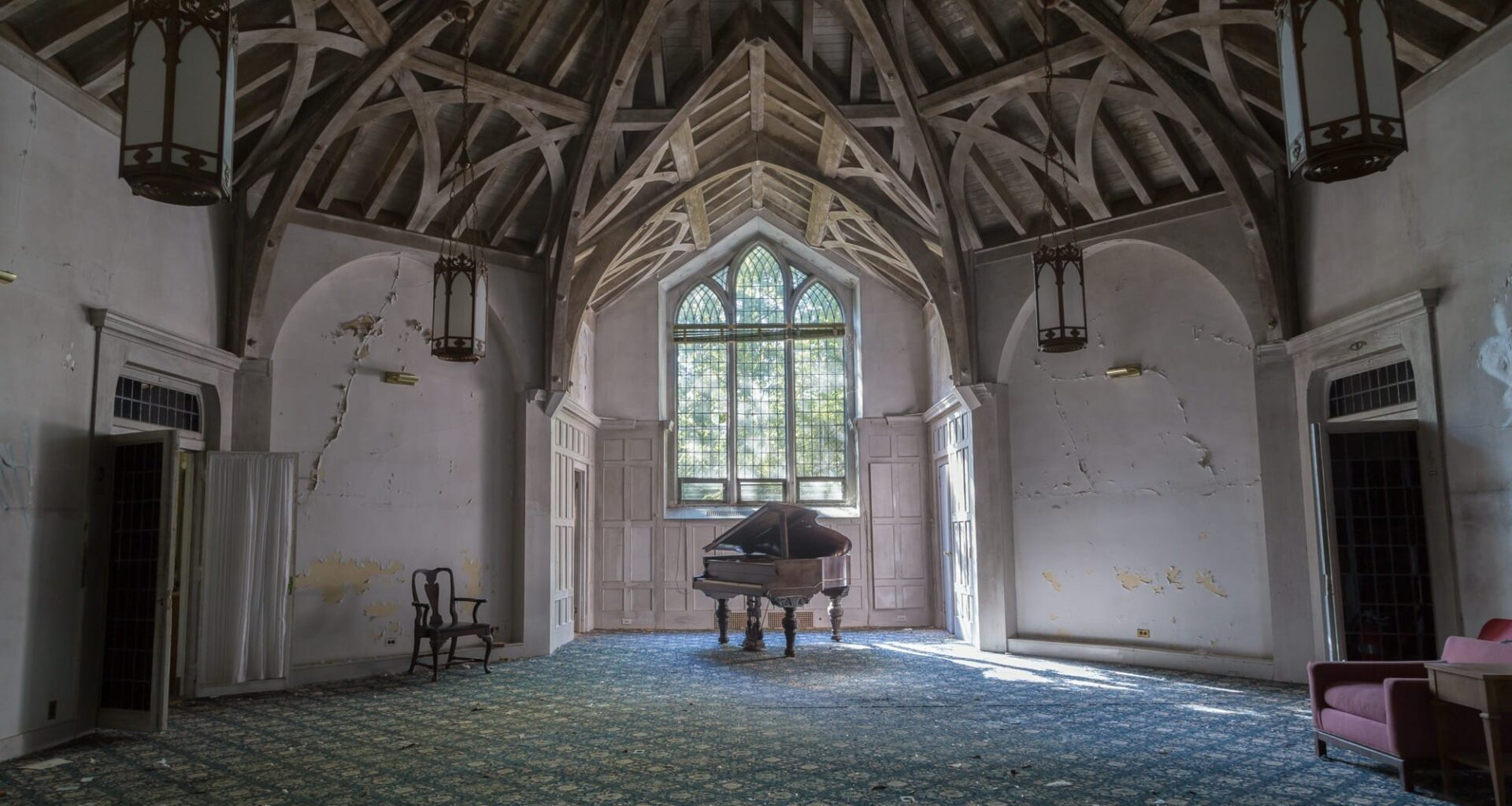 a photo of a large, vaulted room inside an abandoned house by Bryan Sansivero