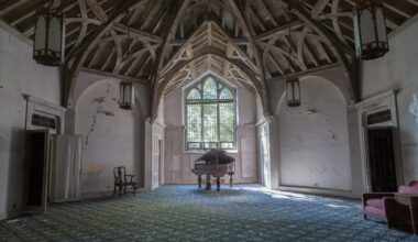 a photo of a large, vaulted room inside an abandoned house by Bryan Sansivero