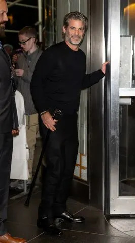 Getty Jim Curtis was pictured quietly entering the premiere after Aniston