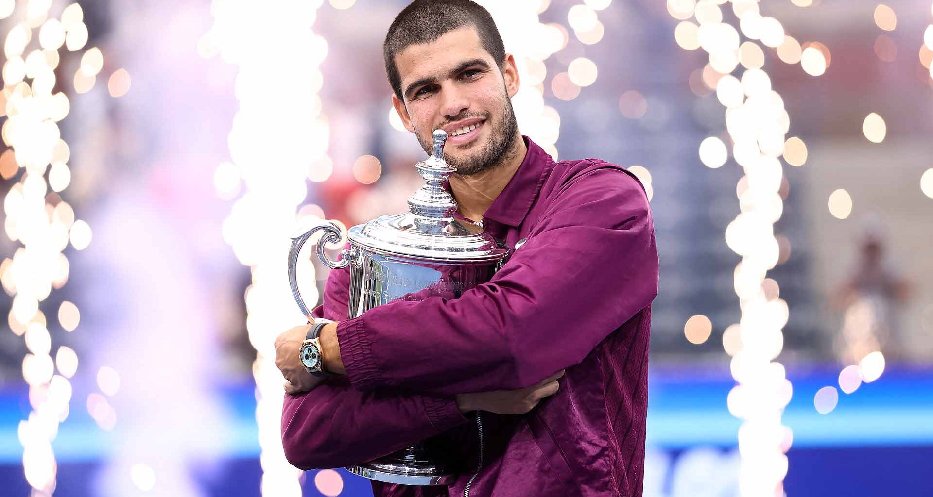 Carlos Alcaraz poses with the trophy after winning his second US Open title Sunday in New York.
