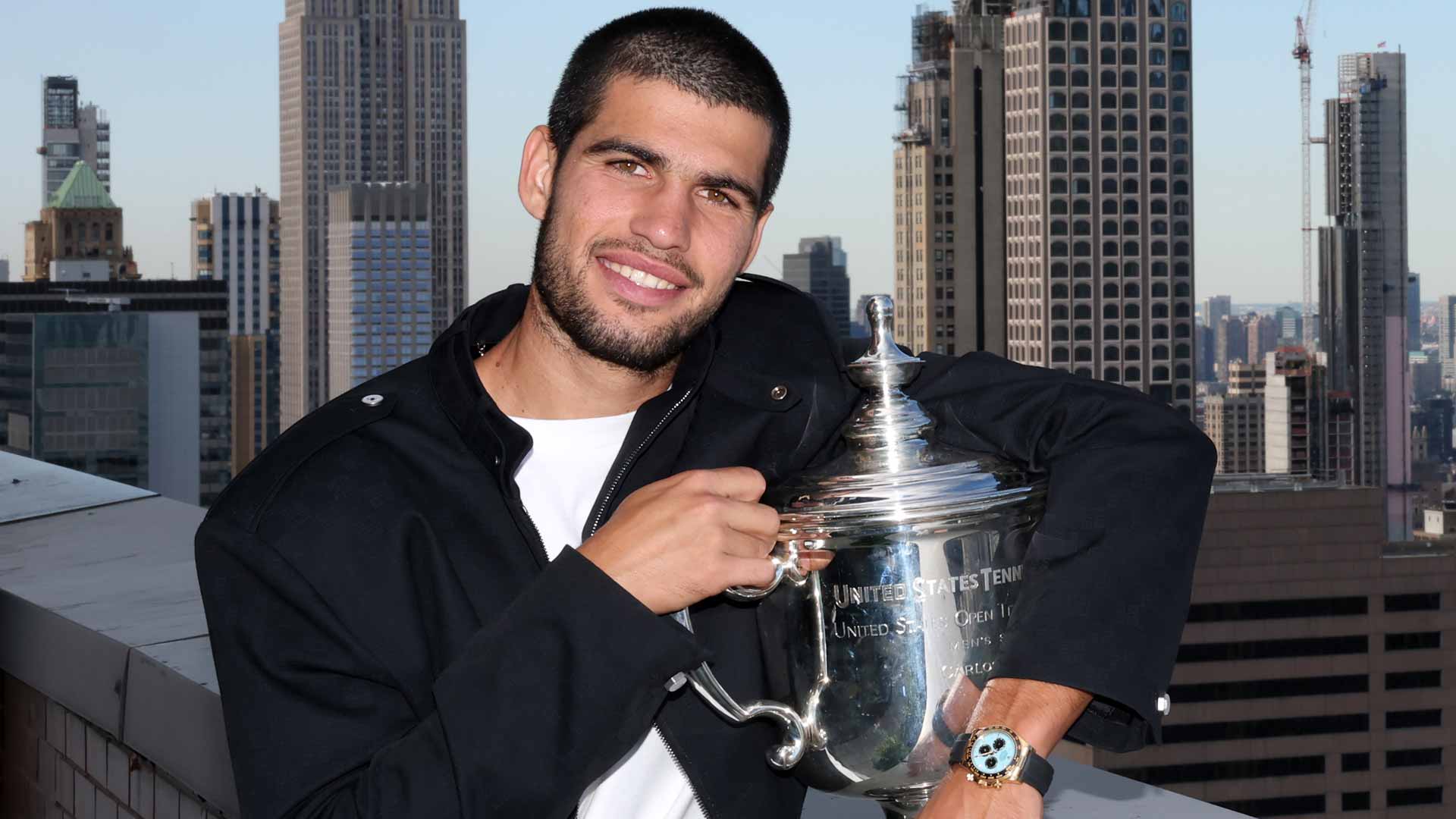 Carlos Alcaraz celebrates his US Open title in front of the Manhattan skyline.