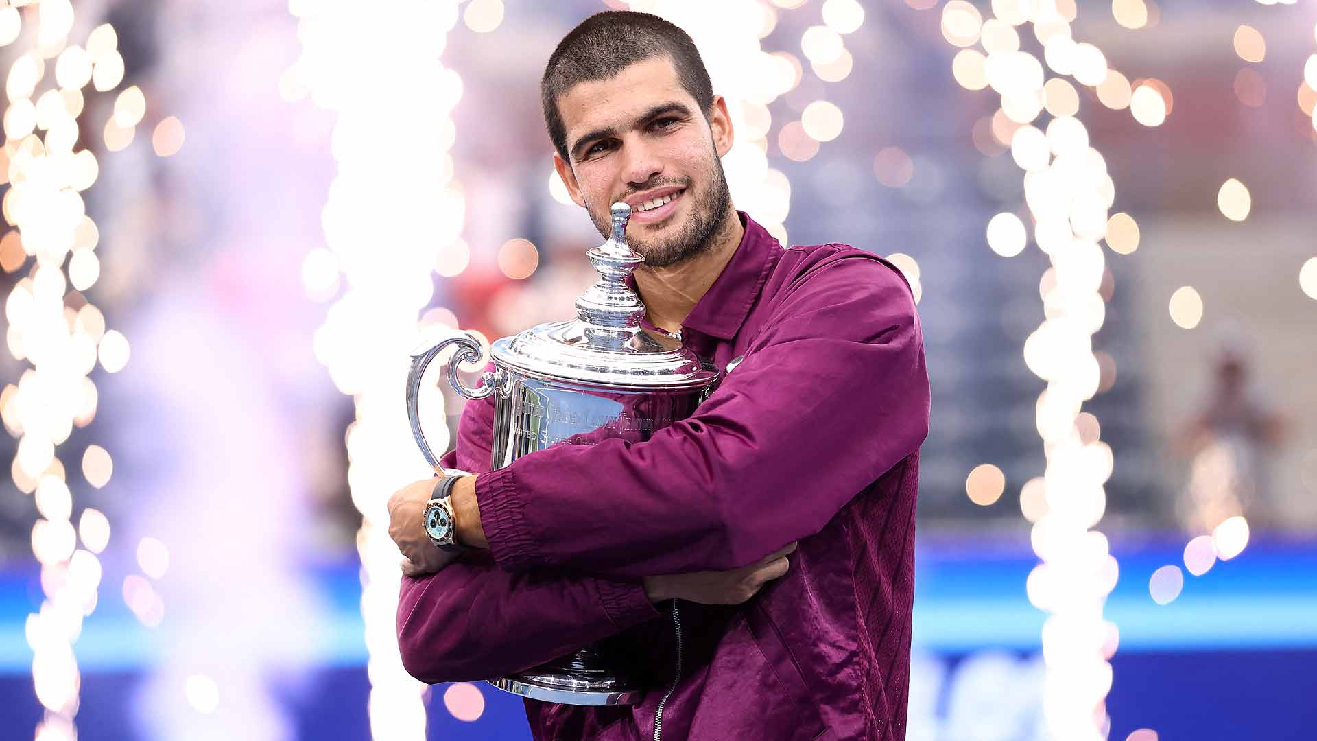 Carlos Alcaraz poses with the trophy after winning his second US Open title Sunday in New York.