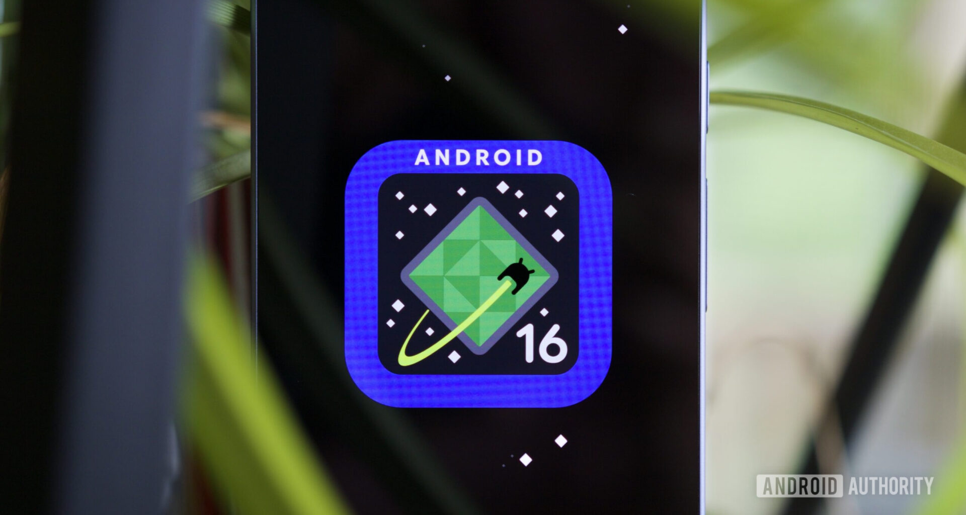 Android 16 logo on a Google Pixel phone.