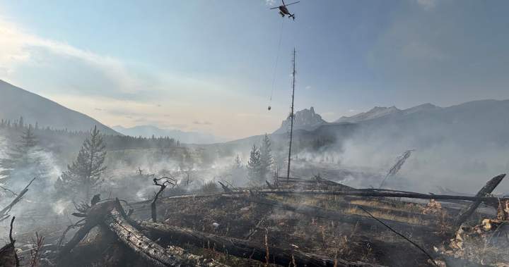 Fire crews working to extinguish a wildfire just west of Banff townsite