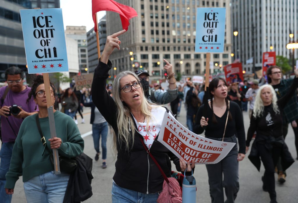 Protesters flip off Trump Tower during a protest against immigration raids in Chicago on Saturday, Sept. 6, 2025.