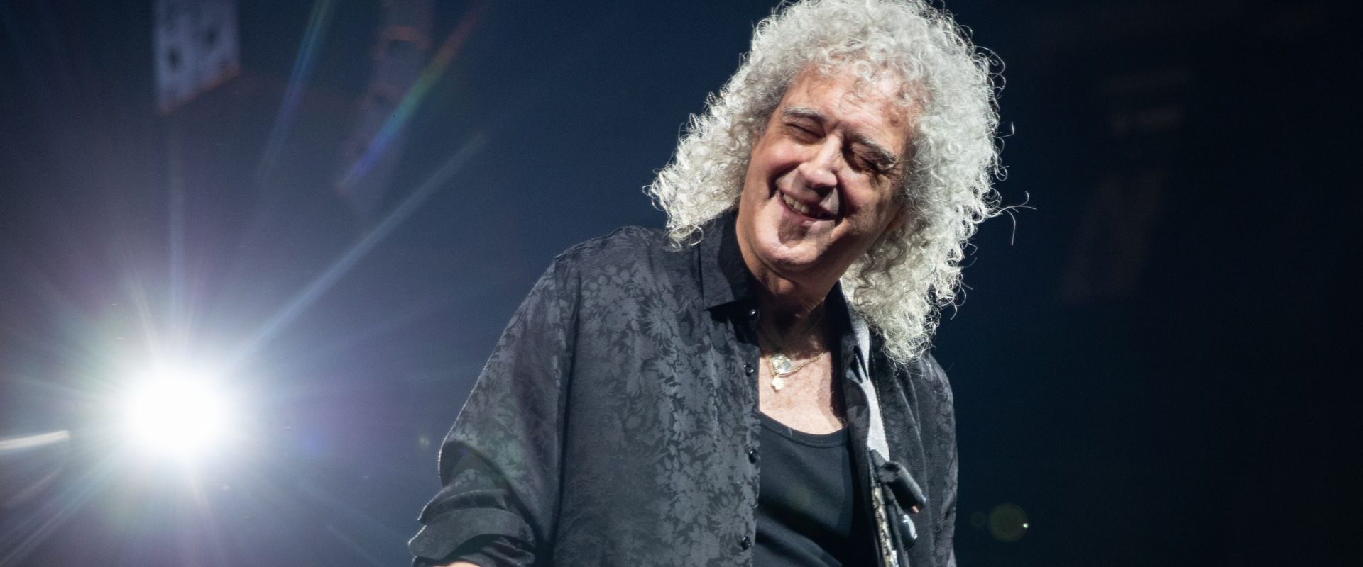 Brian May performing