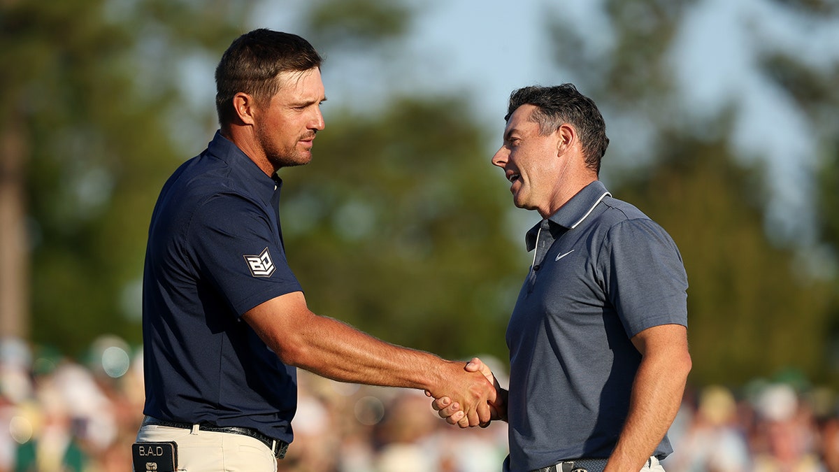 Bryson DeChambeau and Rory McIlroy shake hands