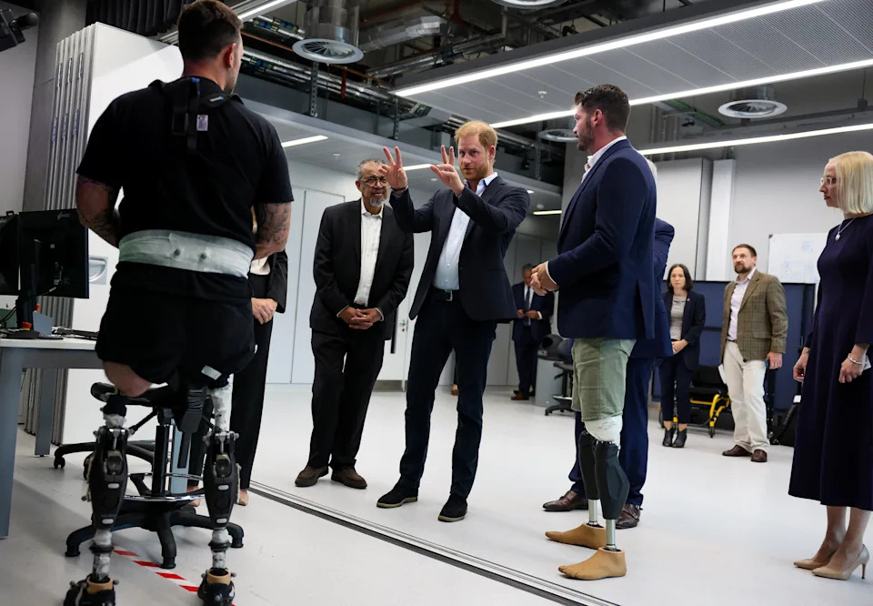 LONDON, ENGLAND - SEPTEMBER 10: Prince Harry, Duke of Sussex speaks with Steve Arnold (L) (Former Invictus Games competitor), as Ambassador of the Centre for Injury Studies Dave Henson (R), and Director-General of the World Health Organization Tedros Adhanom Ghebreyesus (2nd L) look on during a visit to the Centre for Blast Injury Studies at Imperial College London on September 10, 2025 in London, England. (Photo by Suzanne Plunkett - Pool/Getty Images)