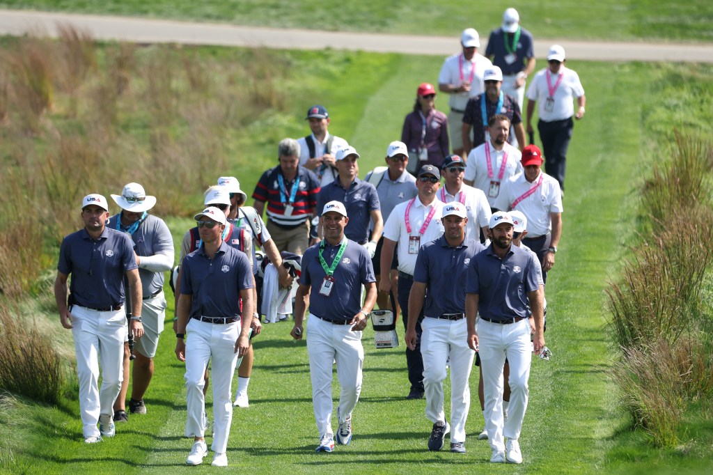 Team United States golfers walking the 17th hole at Bethpage State Park Golf Course.
