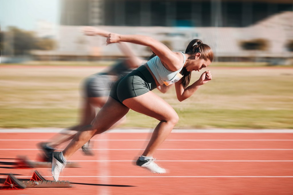 Woman sprinting in a race.