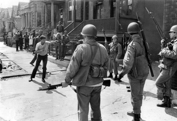 A youth on the West Side points fingers at members of the Illinois National Guard on duty in the area on April 6, 1968, during the riots that broke out after the assassination of Martin Luther King Jr. (William Kelly/Chicago Tribune)