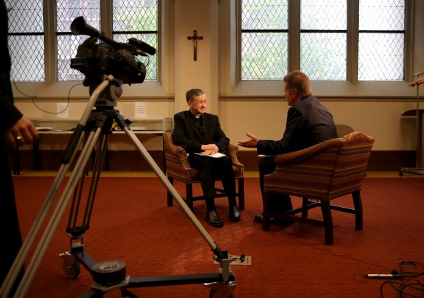 Bishop Blase J. Cupich of Spokane, Washington, center, is announced as the new archbishop designate for Chicago at a news conference at Archbishop Quigley Center on Sept. 20, 2014. (Abel Uribe/Chicago Tribune)