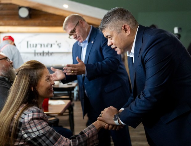 Aaron Del Mar, right, greets people after announcing his bid for lieutentant governor with former state Sen. Darren Bailey in the Republican primary, Sept. 25, 2025, at Turner's Table in Carterville. (Brian Cassella/Chicago Tribune)