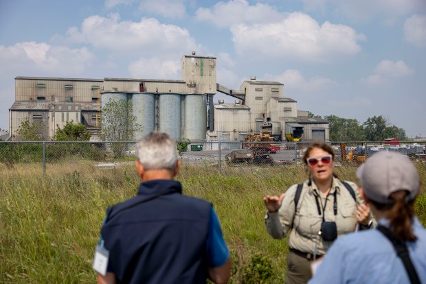 An industrial facility operates just outside the Seidner Dune and Swale, a major restoration site along the Grand Calumet River in Hammond, Indiana on July 31, 2025. The Nature Conservancy of Indiana, Indiana Department of Natural Resources Division of Nature Preserves, and Illinois-Indiana Sea Grant hosted an educator's workshop on the transformation of polluted industrial landscapes into thriving ecosystems. (Brian Cassella/Chicago Tribune)