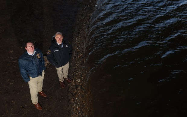 Elgin Detectives Andrew Houghton, left, and Matt Vartanian stand on...