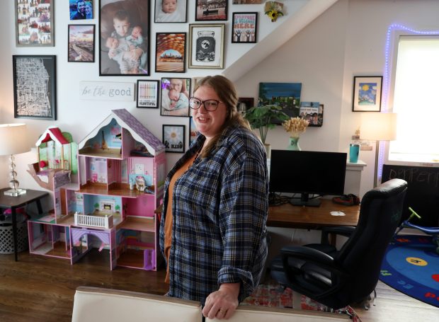 Mollie McGuire stands in her home in Chicago on Sept. 5, 2025. McGuire's son experienced anxiety attacks at his former school and was diagnosed with autism, but school officials repeatedly denied him access to an Individualized Education Plan. McGuire filed a complaint with Chicago's regional Department of Education Office for Civil Rights in 2024. (Terrence Antonio James/Chicago Tribune)
