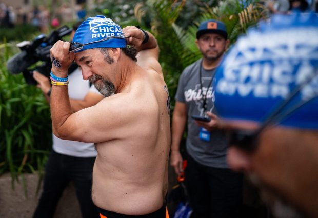 Tim Rooney prepares to jump in the water for his two-mile race during the Chicago River Race on Sept. 21, 2025, in downtown Chicago. (Audrey Richardson/for the Chicago Tribune)