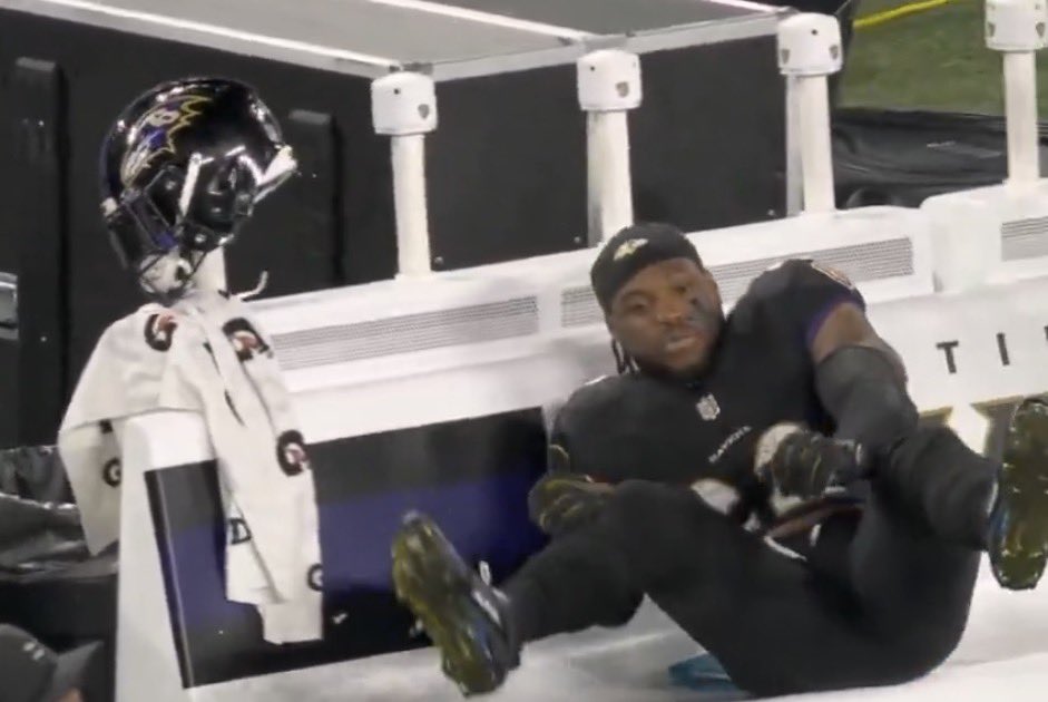 Derrick Henry falls to the bench after slamming his helmet on the sidelines, following a fumble against the Lions.