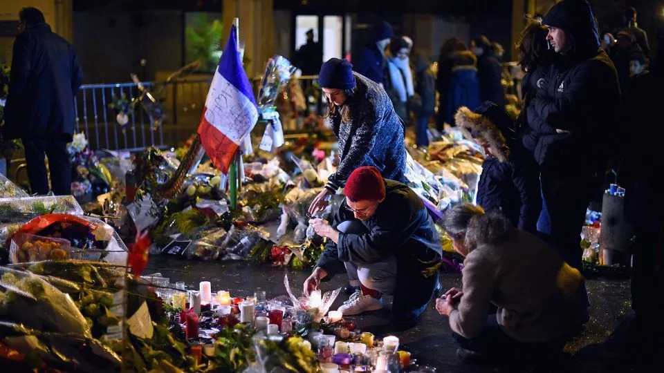 Members of public the light candles in tribute near the offices of French satirical magazine Charlie Hebdo on January 10, 2015 in Paris, France. - Jeff J Mitchell/Getty Images