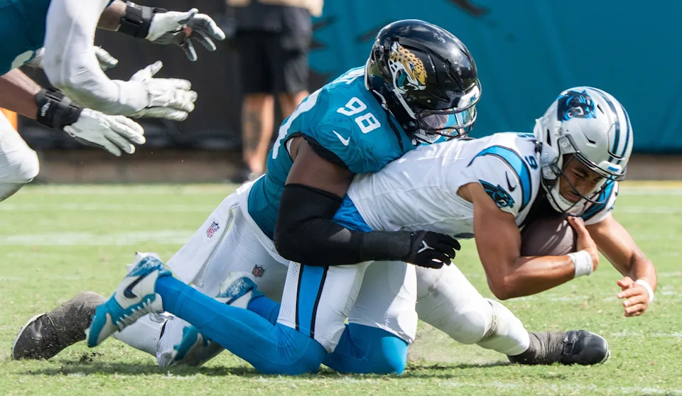 Jaguars defensive end Dawuane Smoot (98) sacks Carolina Panthers quarterback Bryce Young (9) during the third quarter of an NFL football game between the Carolina Panthers at Jacksonville Jaguars at EverBank Stadium Sunday September 7, 2025. Jaguars defeated the Panthers 26-10. [Doug Engle/Florida Times-Union]
