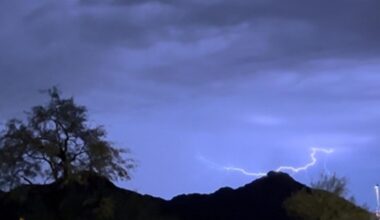 A driver got stuck in a flash flood on a far north Phoenix roadway Friday morning as thunderstorms ...
