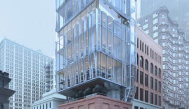 perforated metal panels clad office floating above st. louis's century-old columbia building