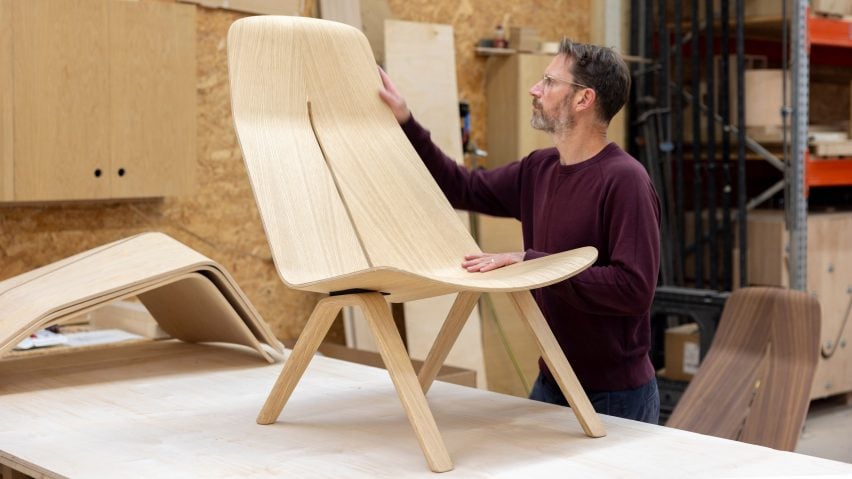 Man with plywood chair