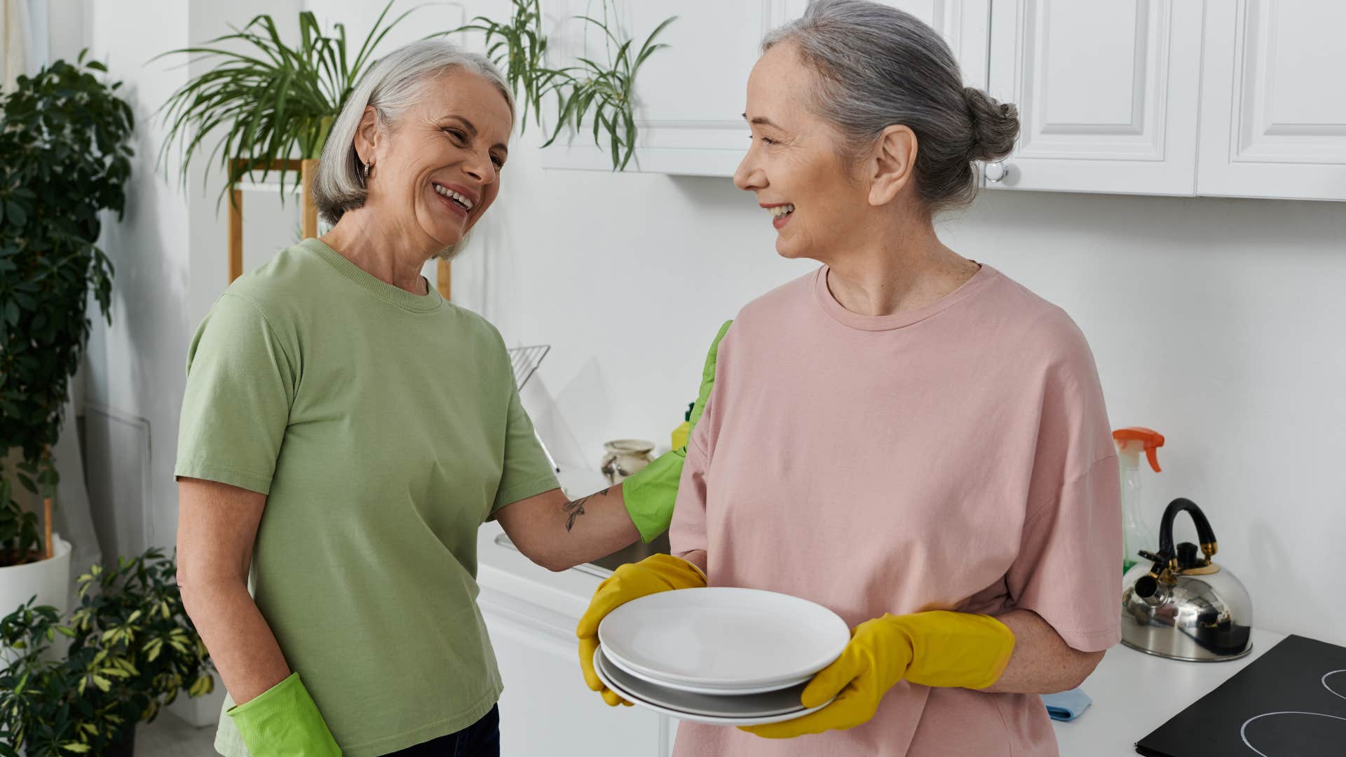 women talking while holding mismatched household essentials