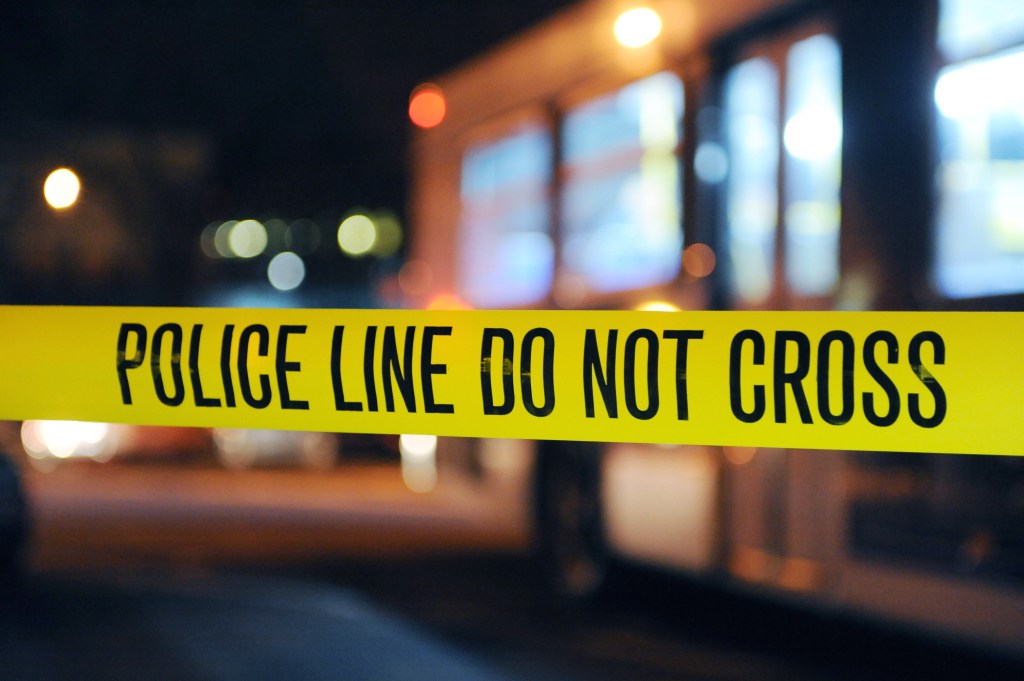 Police line tape at night.
