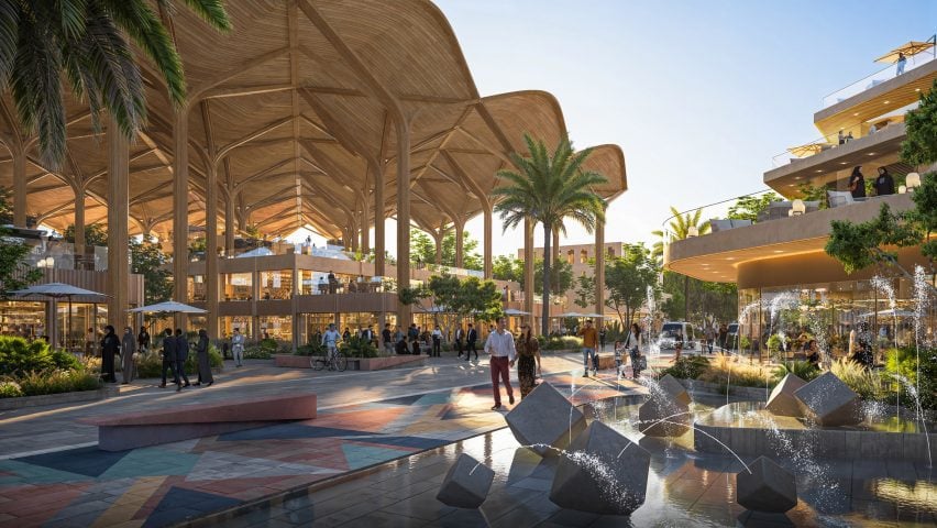 People walking around public space within new district by Gensler