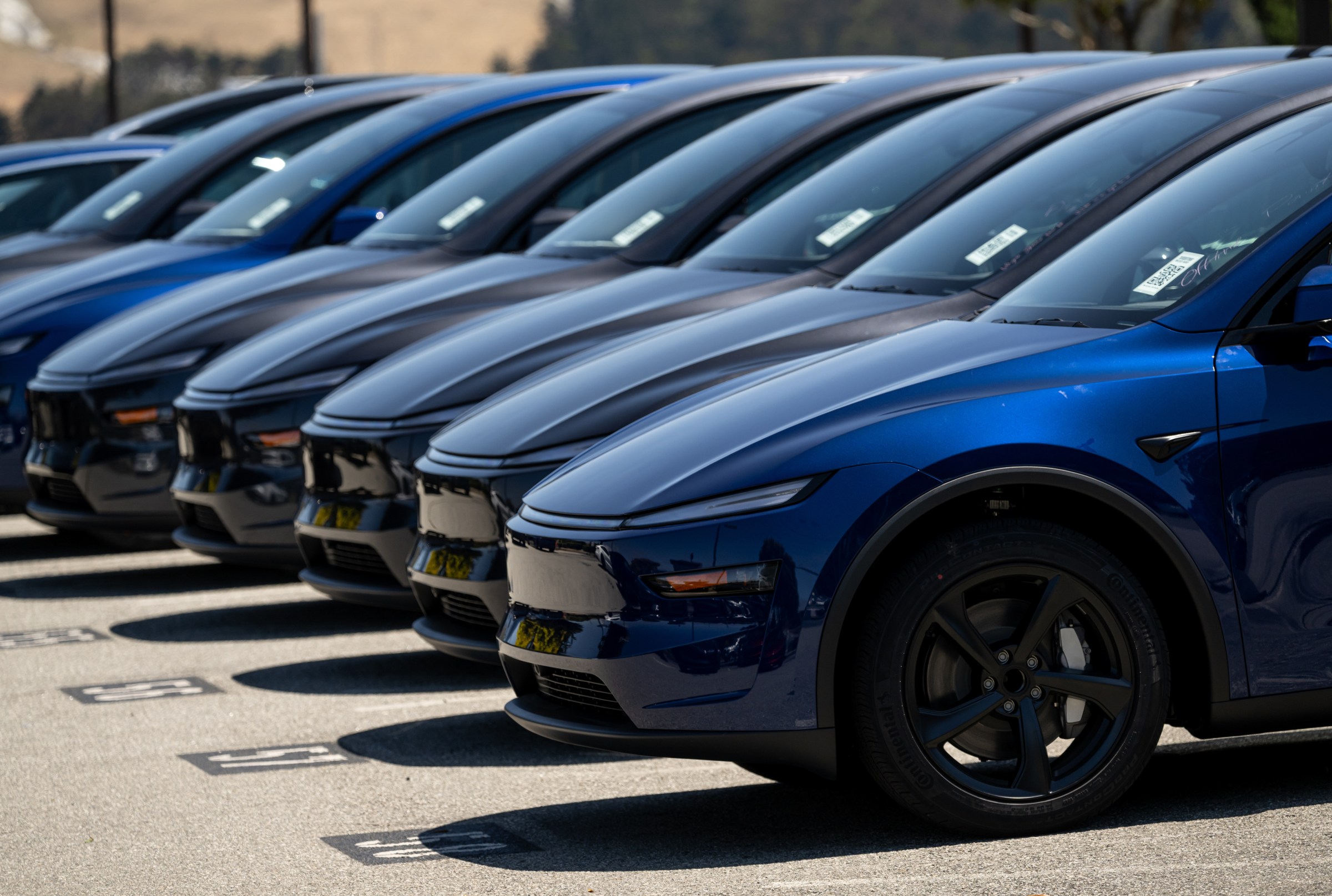 Tesla Model Y electric vehicles at a dealership in Colma, California, on July 1st. Tesla shares fell 4.7 percent in US premarket trading after President Trump lashed out at Elon Musk, accusing the Tesla and SpaceX chief executive officer of benefiting excessively from government subsidies for electric vehicles.