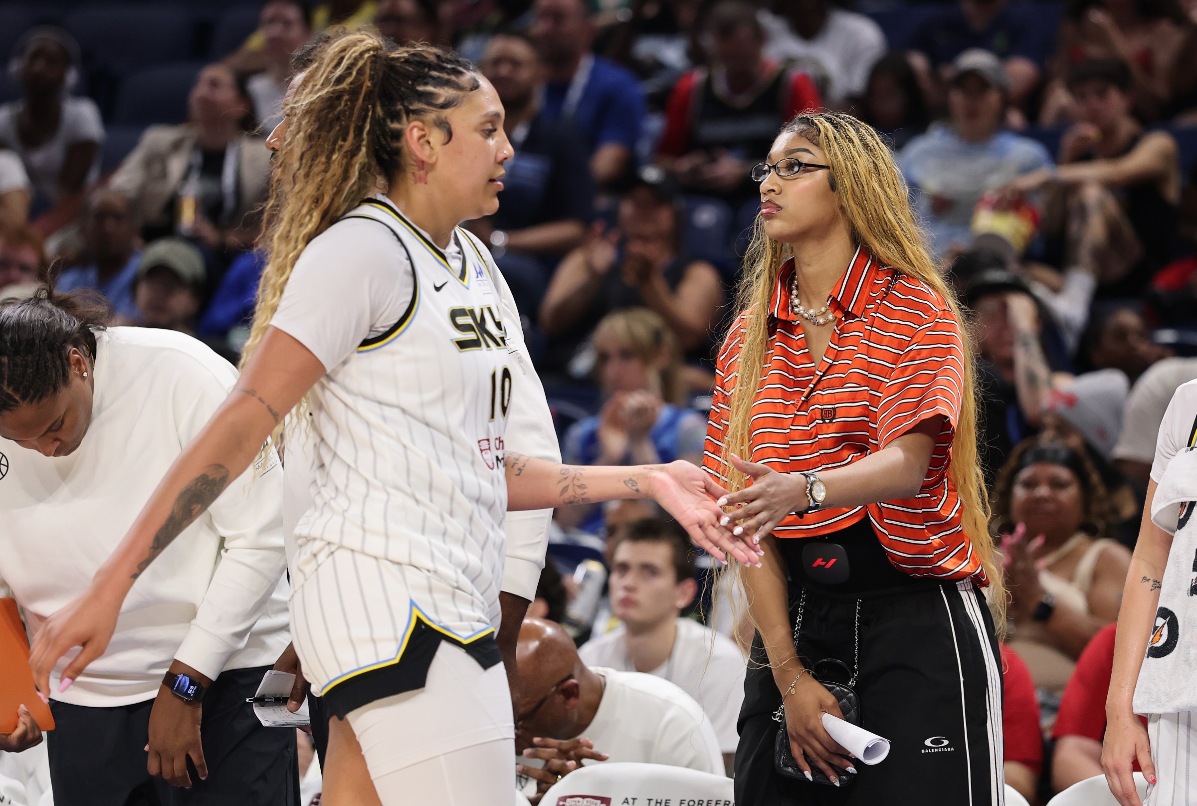 CHICAGO, ILLINOIS - JULY 24: Kamilla Cardoso #10 and Angel Reese #5 of the Chicago Sky high five against the Seattle Storm during the second half at Wintrust Arena on July 24, 2025 in Chicago, Illinois. NOTE TO USER: User expressly acknowledges and agrees that, by downloading and or using this photograph, User is consenting to the terms and conditions of the Getty Images License Agreement. (Photo by Michael Reaves/Getty Images)