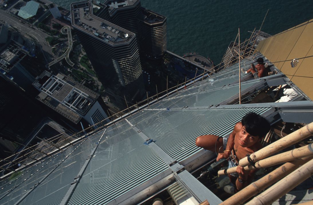 A construction worker pictured in 1991 on the top floors of the 1,227 foot-tall Central Plaza building in Wan Chai, Hong Kong.