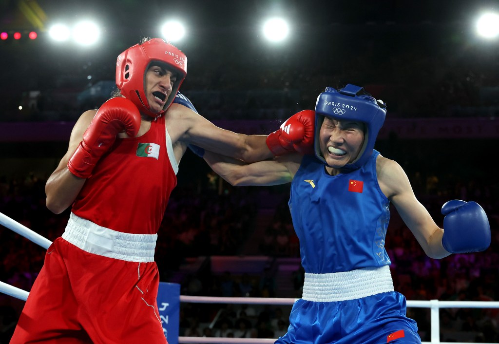 A boxer from Algeria punches a boxer from China during a boxing match at the Paris 2024 Olympic Games.Imane Khelif of Team Algeria punches Liu Yang of Team People's Republic of China during the Boxing Women's 66kg Final match on day fourteen of the Olympic Games Paris 2024