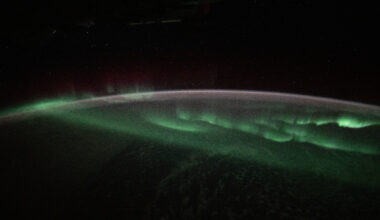 The aurora australis appears to lap over the Earth like a tide washing ashore in this photograph taken at approximately 3:45 a.m. local time from the International Space Station as it orbited 269 miles above the Indian Ocean southwest of Australia.
